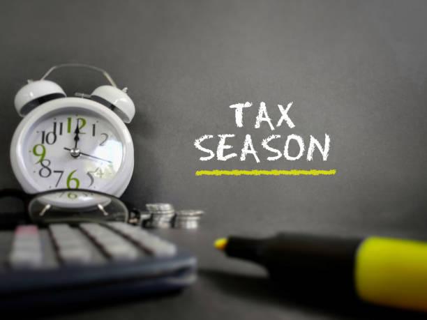 Tax-filling concept Tax season text in vintage background. Stock photo. tax season stock pictures, royalty-free photos & images